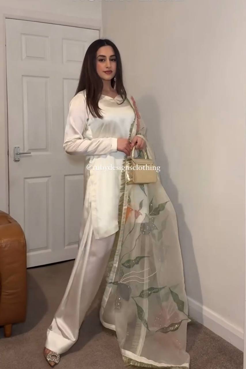 "Grace in Gold & Ivory: Floral Elegance in Traditional Attire"