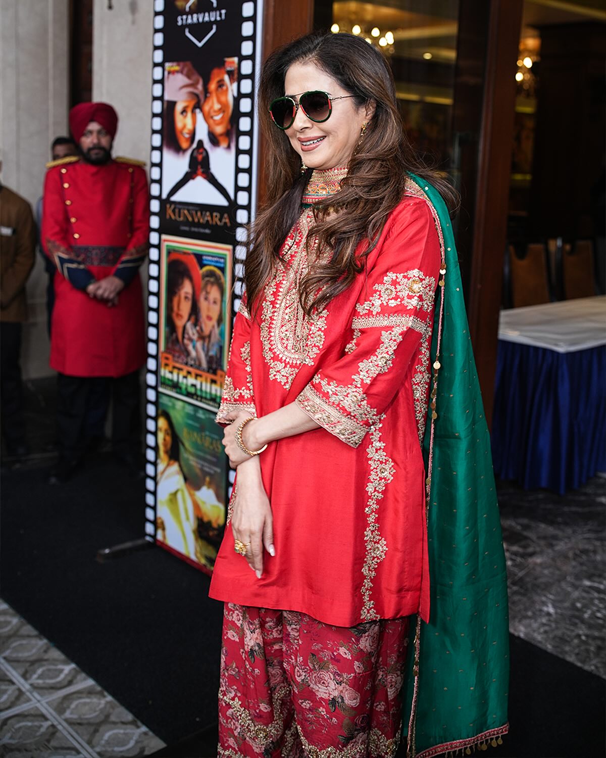 Radiant Red Embroidered Festive Outfit with Gold Detailing and Jewelry