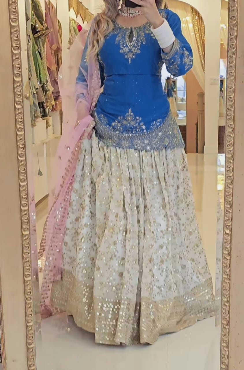 Ethereal Elegance: The Enchanting Blue and Pink Lehenga for the Modern Woman's Grand Affair