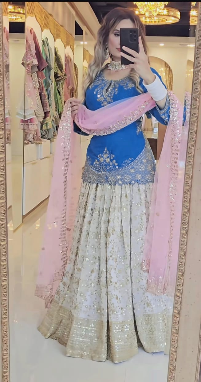 Ethereal Elegance: The Enchanting Blue and Pink Lehenga for the Modern Woman's Grand Affair