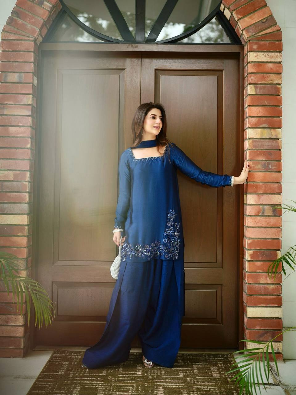Elegant Harmony: The Blue Suited Muse Embracing Nature's Serenity in a Chic Urban Oasis