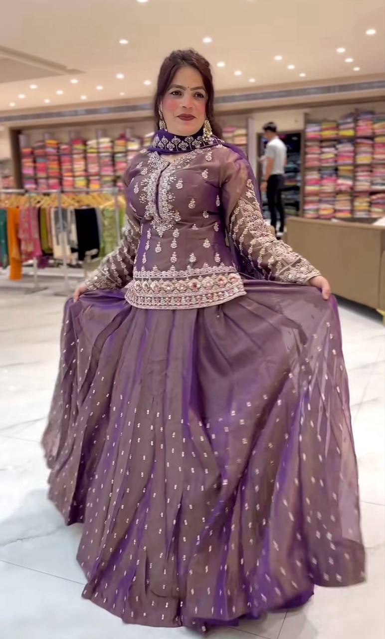 Graceful Mauve Peplum Suit Adorned with Intricate Embroidery Details