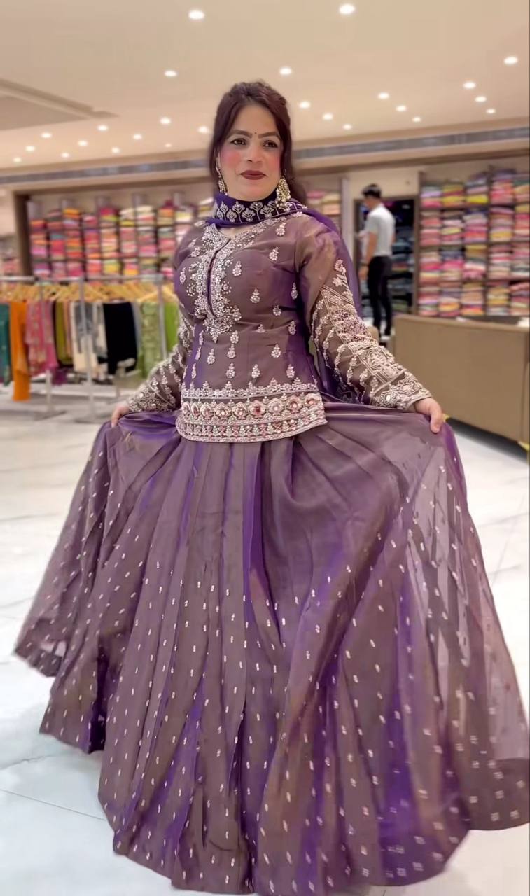 Graceful Mauve Peplum Suit Adorned with Intricate Embroidery Details