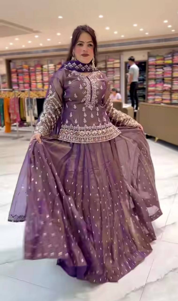 Graceful Mauve Peplum Suit Adorned with Intricate Embroidery Details