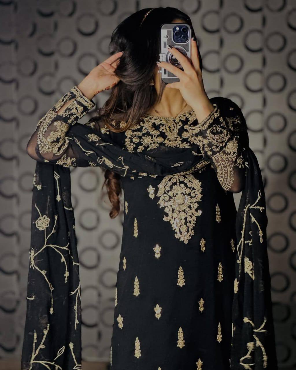 Sophisticated Selfie: A Woman's Poise in Elegant Black Ensemble