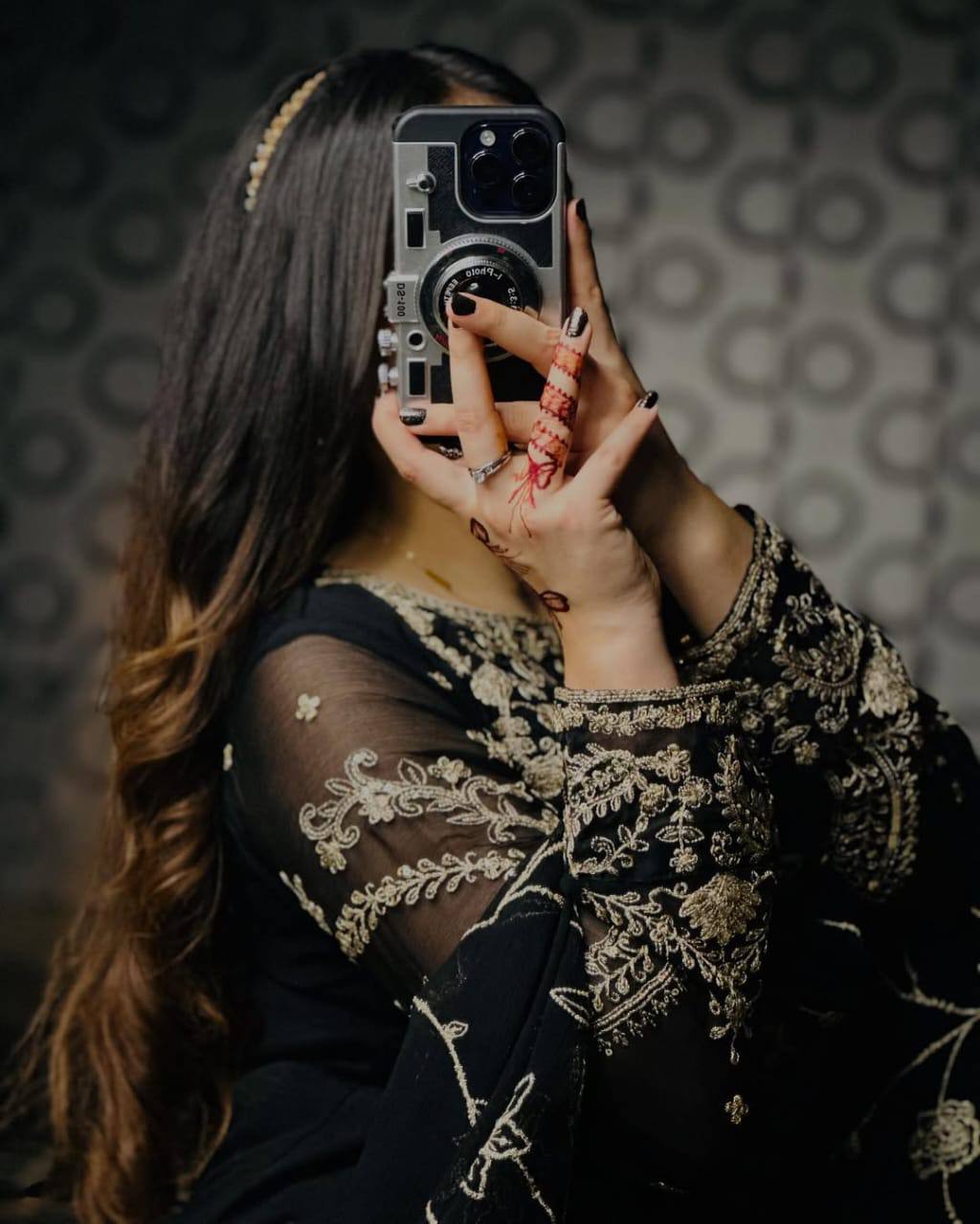 Sophisticated Selfie: A Woman's Poise in Elegant Black Ensemble