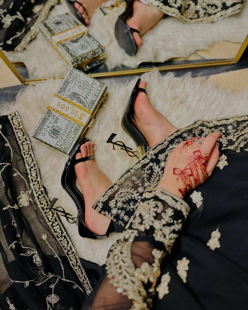 Sophisticated Selfie: A Woman's Poise in Elegant Black Ensemble